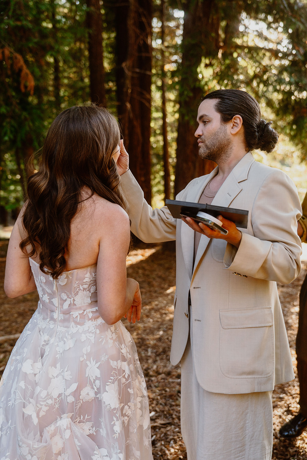 Carwin Brice with bride — forest touch-up behind the scenes